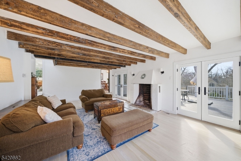 109 Taylortown Road Montville, NJ 07005 - Photo 8 of 50 a living room with furniture and a chandelier