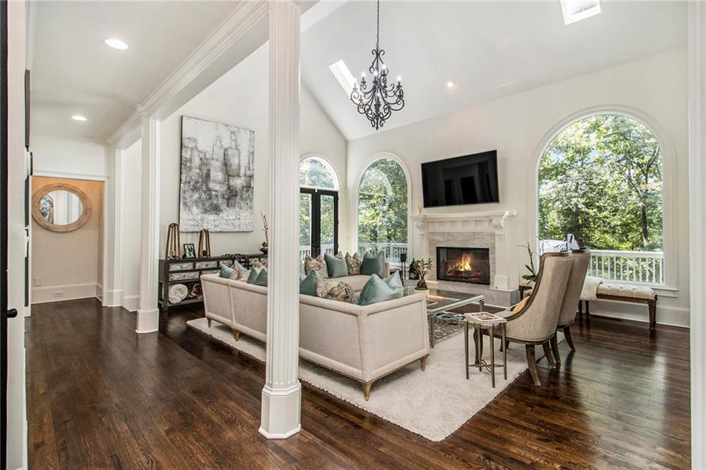 240 Wicklawn Way Roswell, GA 30076 - Photo 19 of 62 a living room with furniture a fireplace and a flat screen tv