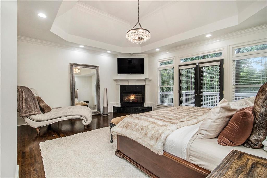 240 Wicklawn Way Roswell, GA 30076 - Photo 23 of 62 a bedroom with a large bed and a flat screen tv