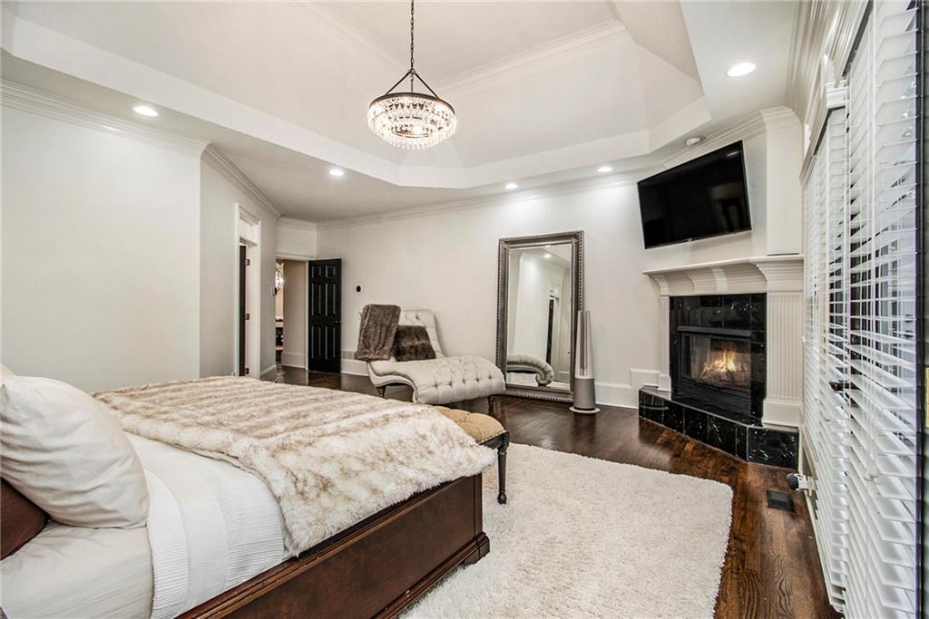 240 Wicklawn Way Roswell, GA 30076 - Photo 24 of 62 a spacious bedroom with a bed and a flat screen tv