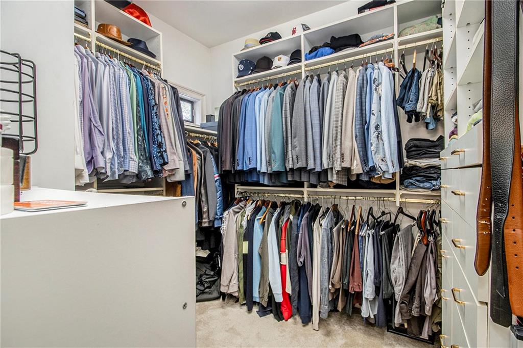 240 Wicklawn Way Roswell, GA 30076 - Photo 30 of 62 a view of walk in closet with clothes