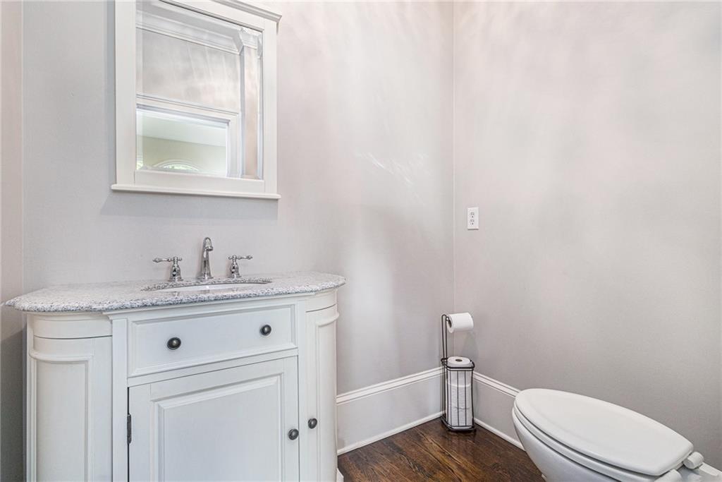 240 Wicklawn Way Roswell, GA 30076 - Photo 31 of 62 a bathroom with a granite countertop toilet sink and mirror