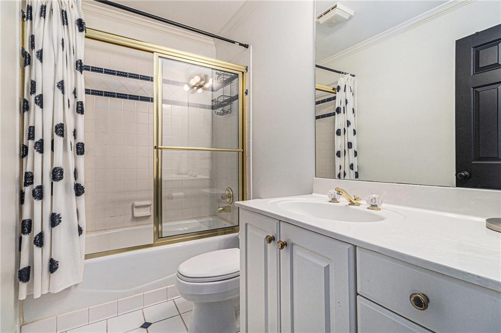 240 Wicklawn Way Roswell, GA 30076 - Photo 45 of 62 a bathroom with a sink a toilet and shower