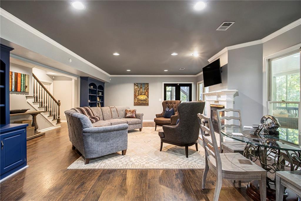 240 Wicklawn Way Roswell, GA 30076 - Photo 47 of 62 a living room with furniture and a wooden floor