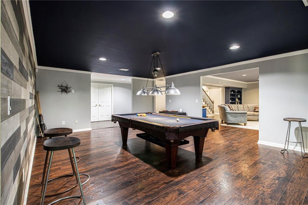 240 Wicklawn Way Roswell, GA 30076 - Photo 49 of 62 a room with wooden floor table tennis and arcade game machine