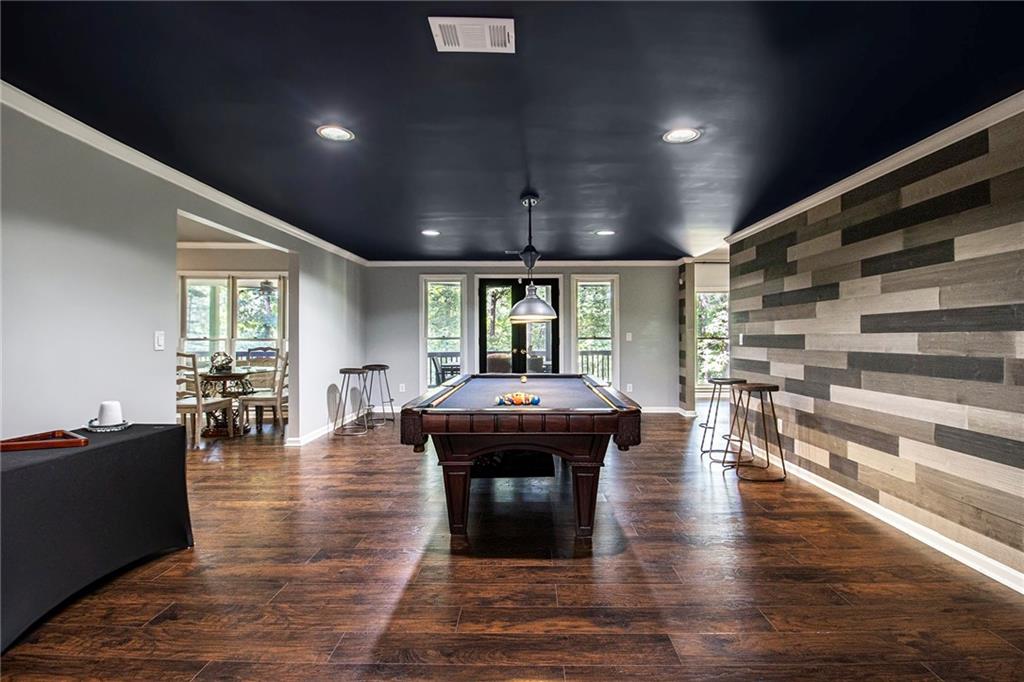 240 Wicklawn Way Roswell, GA 30076 - Photo 50 of 62 a room with lots of furniture and wooden floors