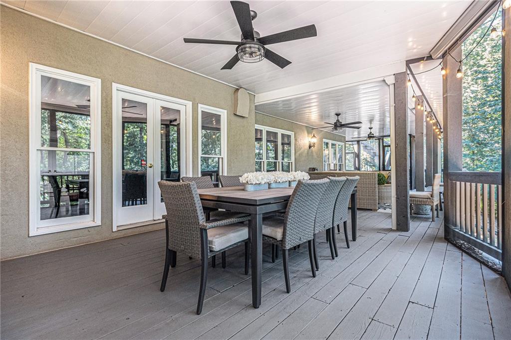 240 Wicklawn Way Roswell, GA 30076 - Photo 60 of 62 a dining room with furniture window wooden floor and a chandelier