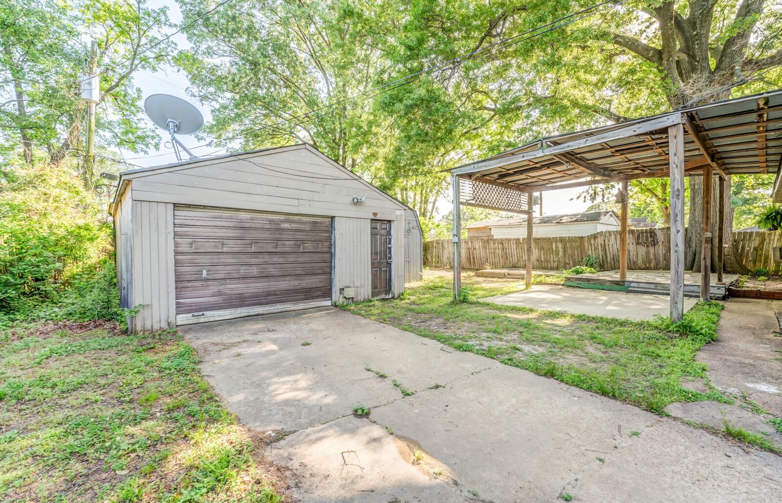 4621 Macon Road Memphis, TN 38122 - Photo 34 of 40 a backyard of a house with yard and outdoor seating