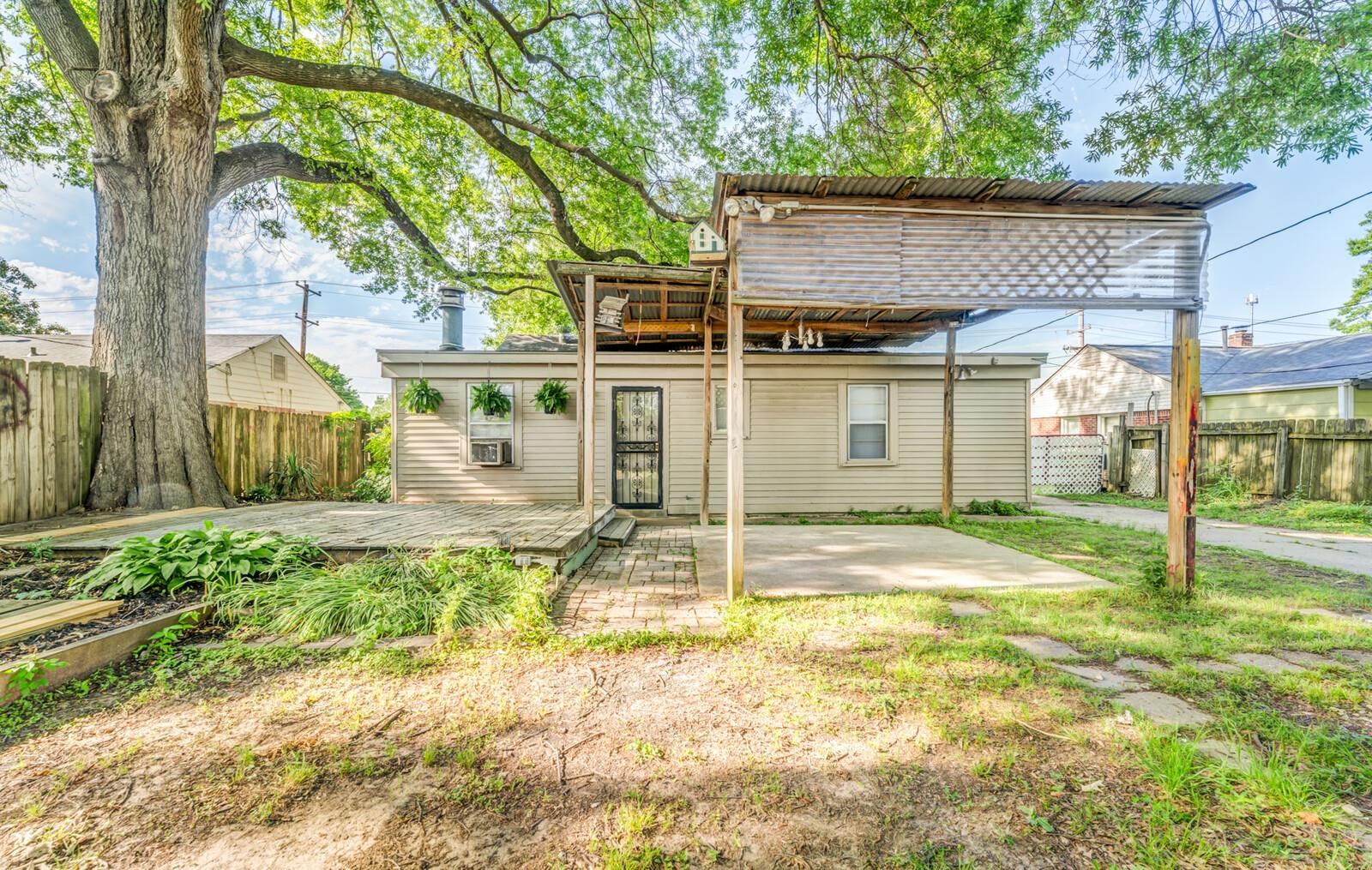 4621 Macon Road Memphis, TN 38122 - Photo 39 of 40 a view of a house with backyard and a tree
