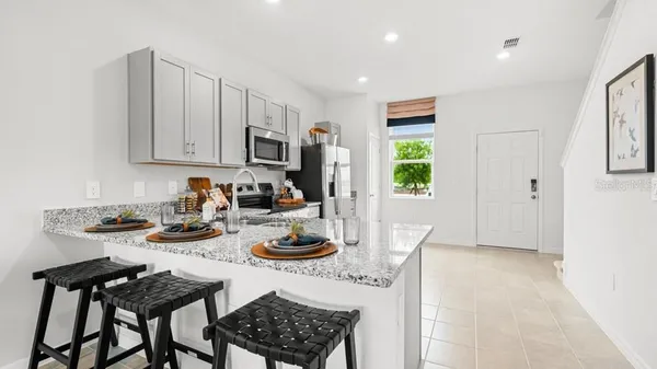 a kitchen with a sink a stove and refrigerator