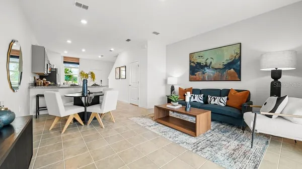 a bedroom with bed and night stand