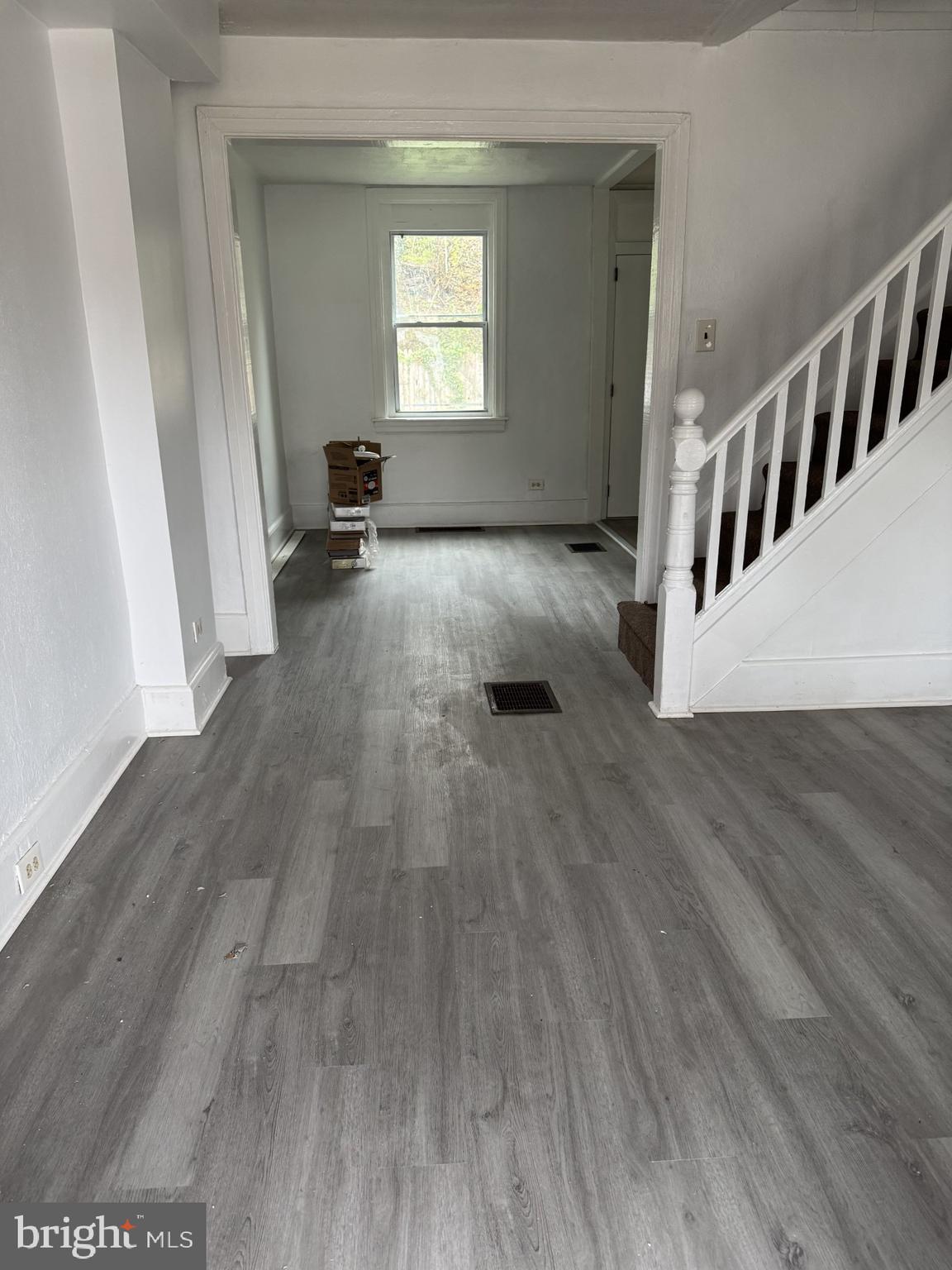 620 Keystone Avenue Darby, PA 19023 - Photo 2 of 13 a view of an empty room with wooden floor and a window