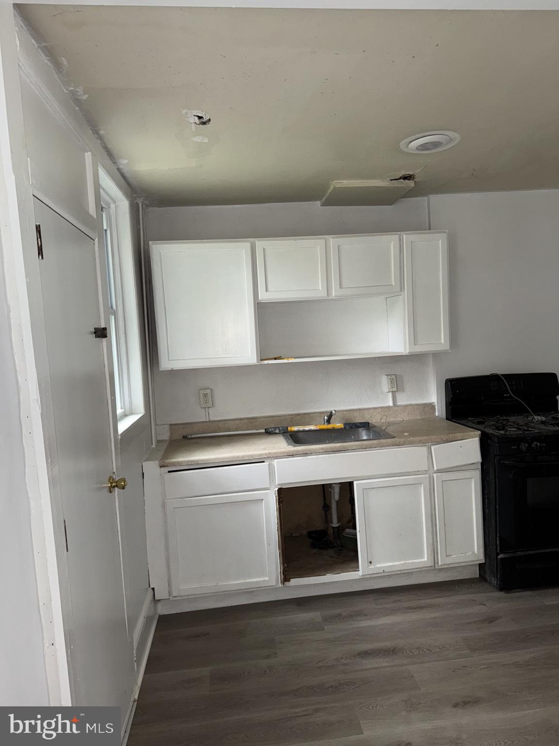 620 Keystone Avenue Darby, PA 19023 - Photo 6 of 13 a kitchen with a stove and a refrigerator