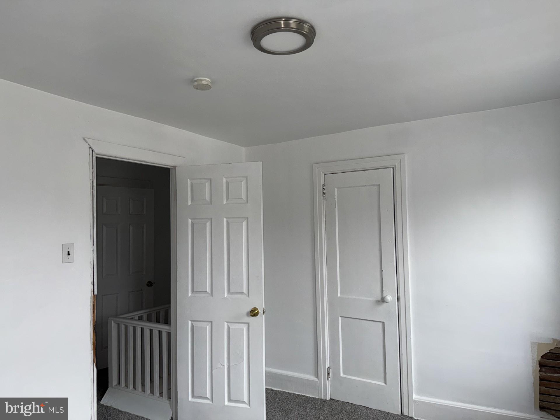 620 Keystone Avenue Darby, PA 19023 - Photo 9 of 13 an empty room with wooden floor and windows