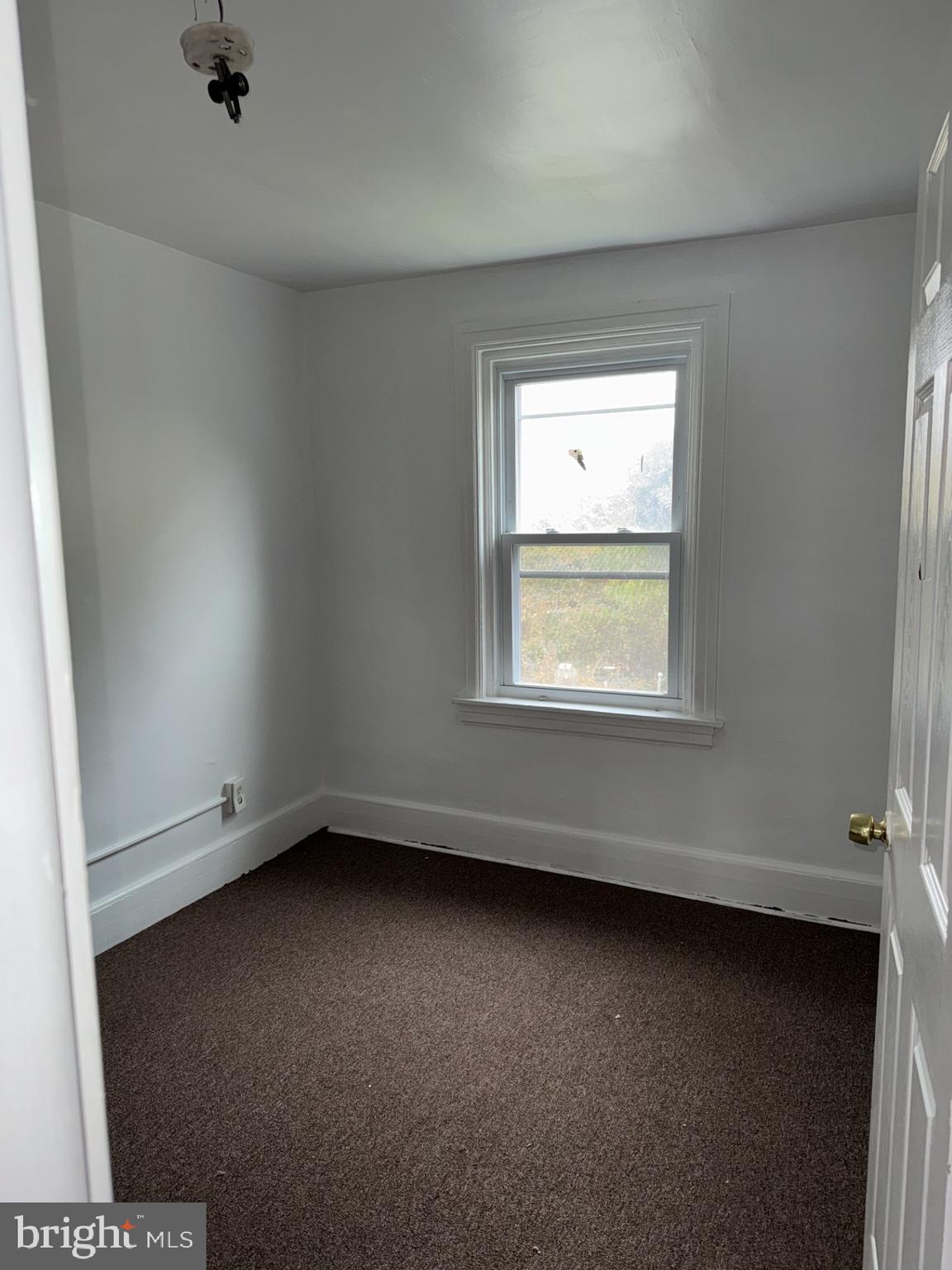 620 Keystone Avenue Darby, PA 19023 - Photo 10 of 13 an empty room with a window