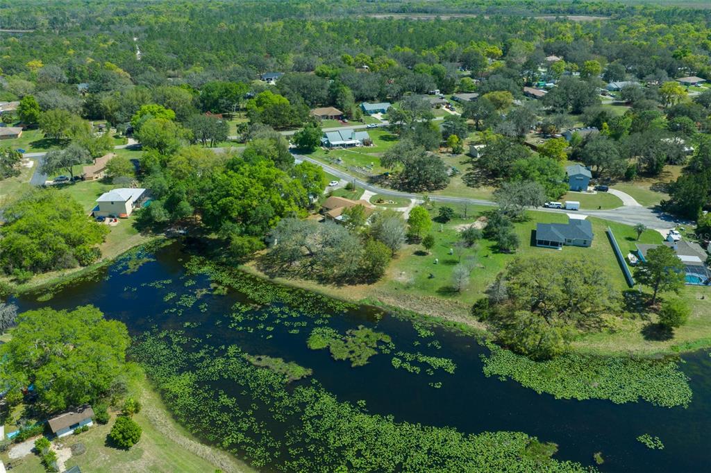 9923 East St Regis Court Inverness, FL 34450 - Photo 12 of 76 an aerial view of a house with a yard