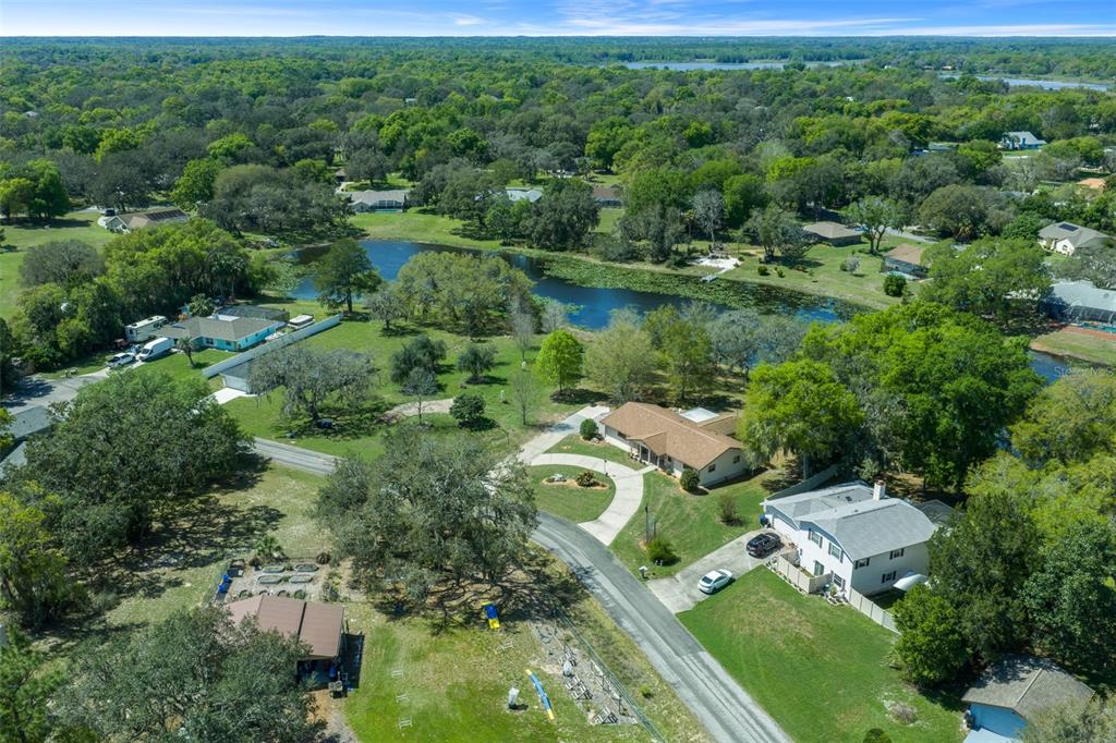 9923 East St Regis Court Inverness, FL 34450 - Photo 5 of 76 an aerial view of residential houses with outdoor space and trees