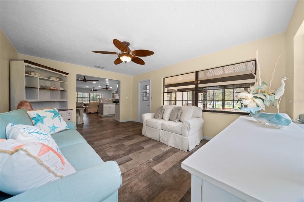 9923 East St Regis Court Inverness, FL 34450 - Photo 58 of 76 a living room with furniture and a large window