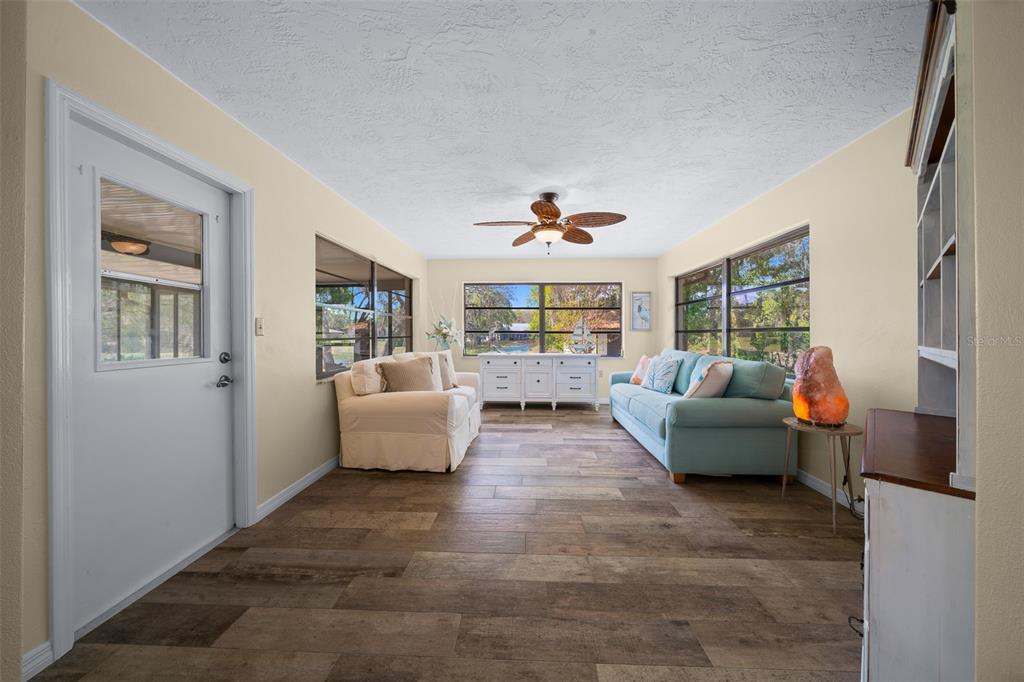 9923 East St Regis Court Inverness, FL 34450 - Photo 59 of 76 a living room with furniture and a window