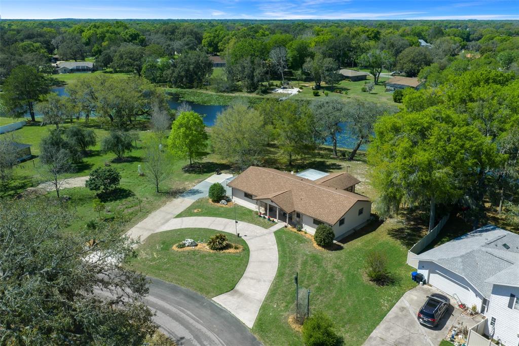 9923 East St Regis Court Inverness, FL 34450 - Photo 6 of 76 an aerial view of a house with outdoor space and street view