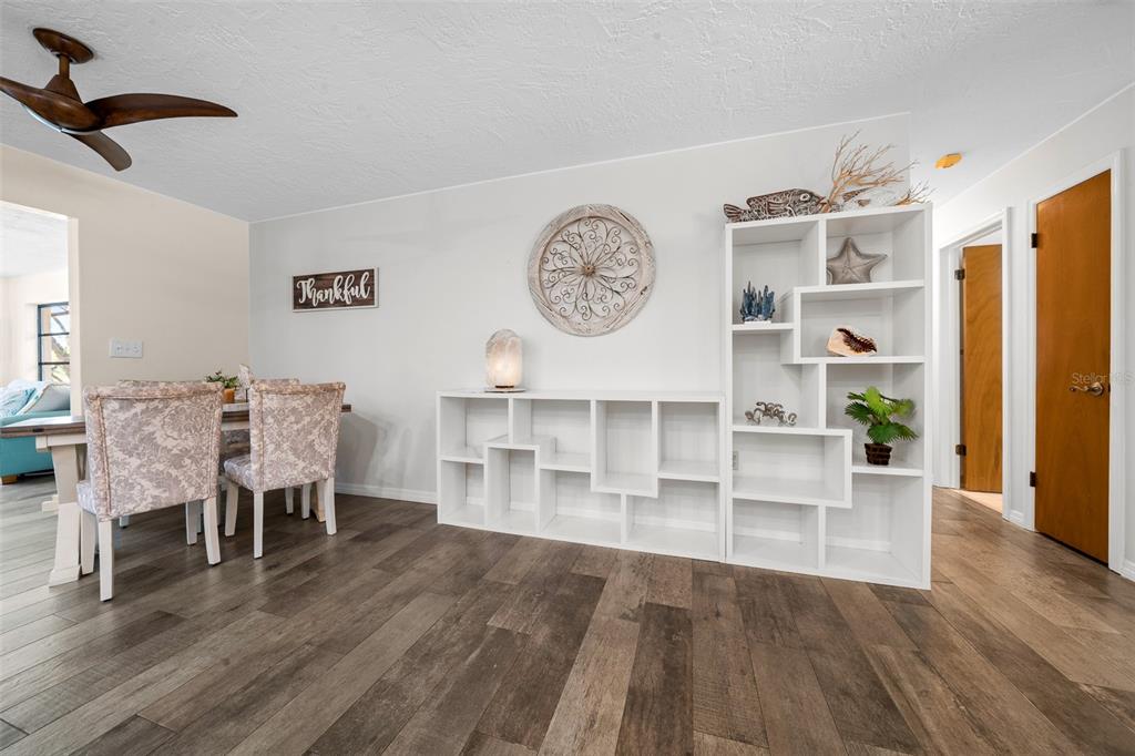 9923 East St Regis Court Inverness, FL 34450 - Photo 64 of 76 a living room with furniture and wooden floor