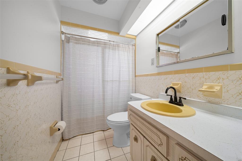 9923 East St Regis Court Inverness, FL 34450 - Photo 65 of 76 a bathroom with a sink a toilet and shower