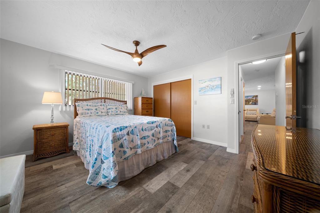 9923 East St Regis Court Inverness, FL 34450 - Photo 68 of 76 a bedroom with a bed and wooden floor
