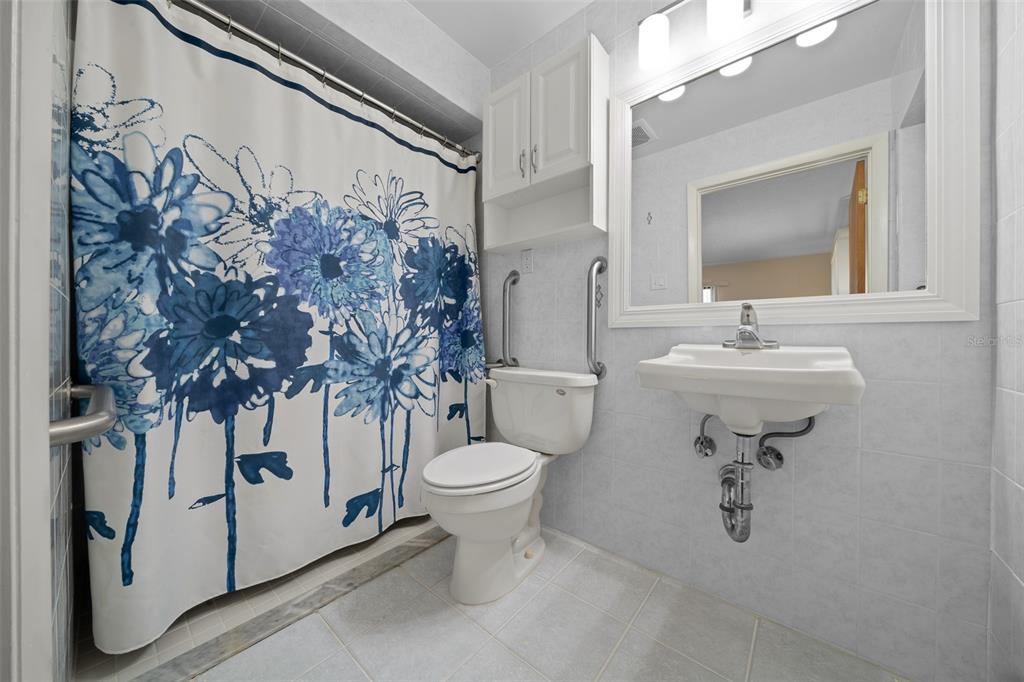 9923 East St Regis Court Inverness, FL 34450 - Photo 75 of 76 a bathroom with a sink toilet and shower