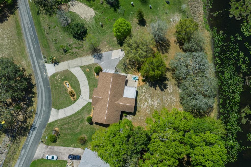 9923 East St Regis Court Inverness, FL 34450 - Photo 8 of 76 an aerial view of a house with a garden