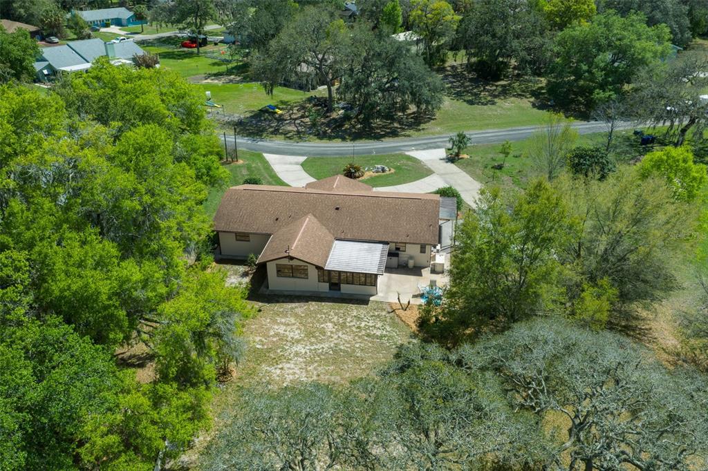 9923 East St Regis Court Inverness, FL 34450 - Photo 9 of 76 an aerial view of a house with yard and green space