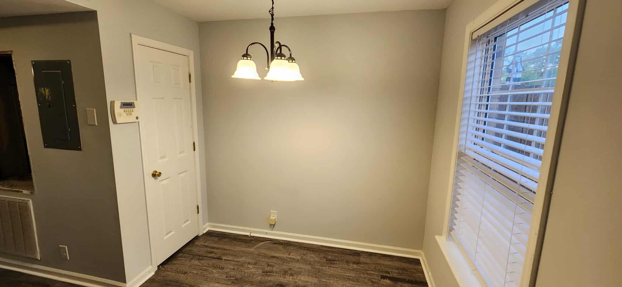 289 Raleigh Drive, Unit B Clarksville, TN 37043 - Photo 8 of 22 a view of an empty room with wooden floor and a window