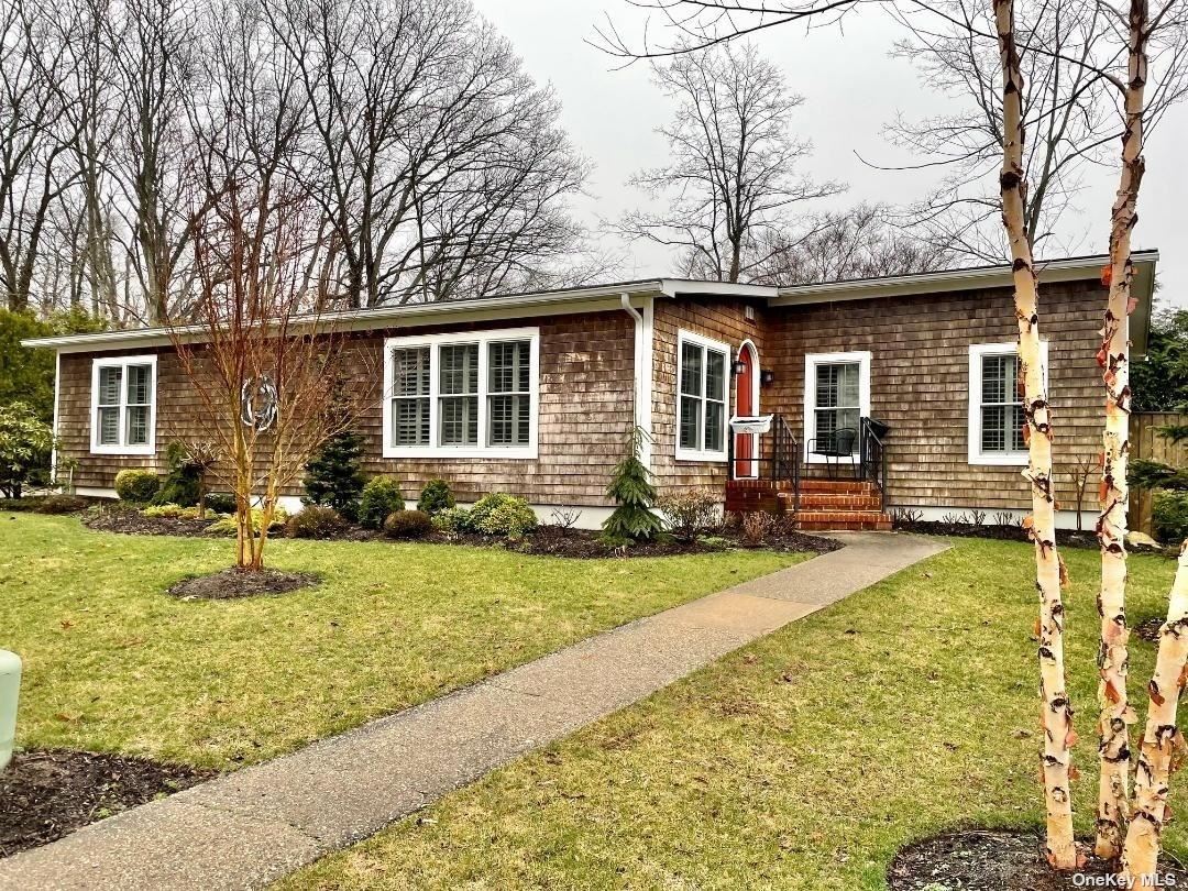 1661-404 Old Country Road Riverhead, NY 11901 - Photo 1 of 1 front view of house with a yard