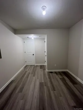 an empty room with wooden floor