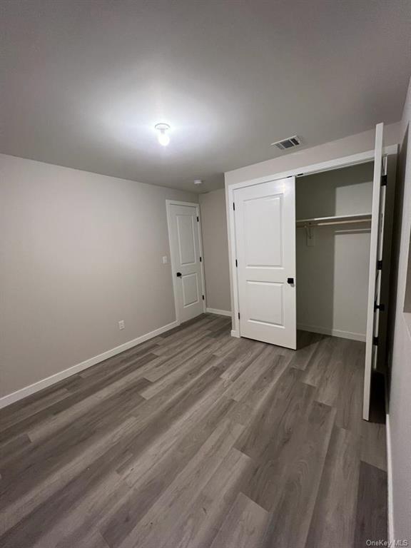 65 South Airmont Road Suffern, NY 10901 - Photo 19 of 23 an empty room with closet and mirror