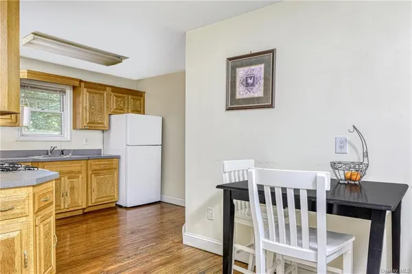 a bedroom with furniture and a large window