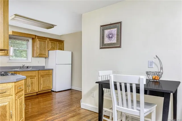 a bedroom with furniture and a large window