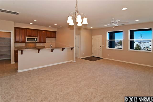 a view of kitchen with cabinets and stainless steel appliances