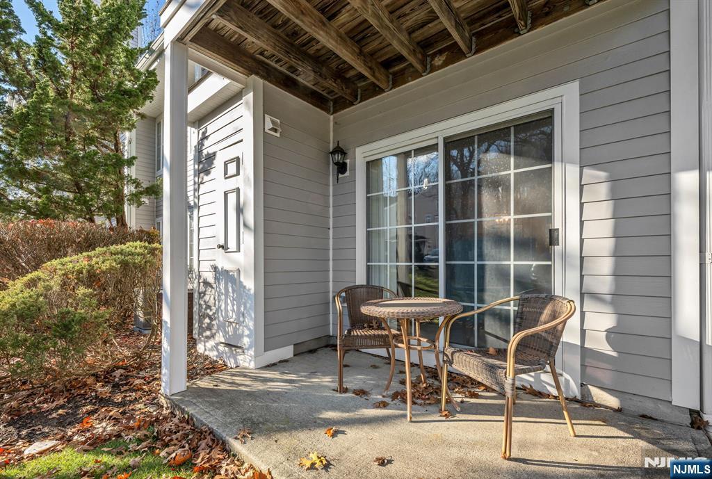 1155 Garrison Court Mahwah, NJ 07430 - Photo 19 of 26 a patio with table and chairs and potted plants