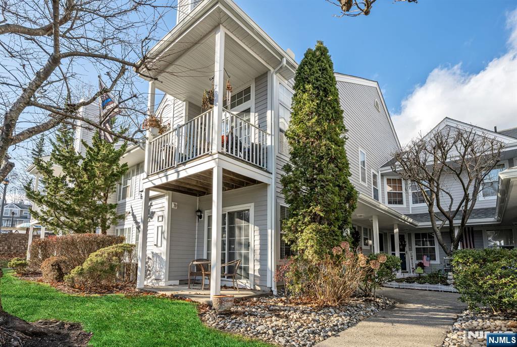 1155 Garrison Court Mahwah, NJ 07430 - Photo 2 of 26 a front view of a house with a yard