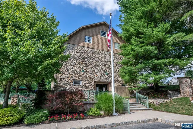 a view of a patio with a table and chairs