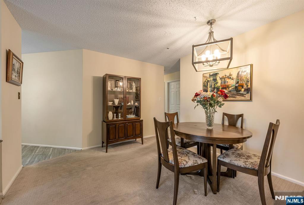 1155 Garrison Court Mahwah, NJ 07430 - Photo 8 of 26 a view of a dining room with furniture and wooden floor