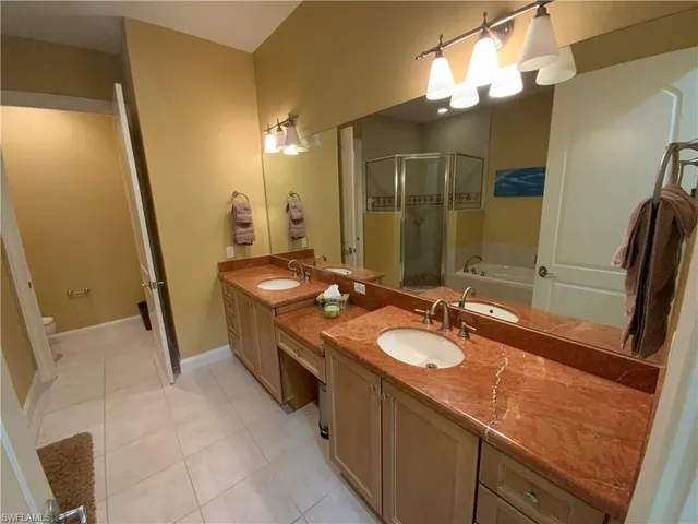 a bathroom with a sink a vanity and a mirror