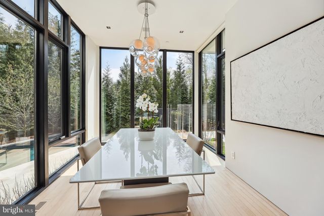 a view of living room with furniture and a large window