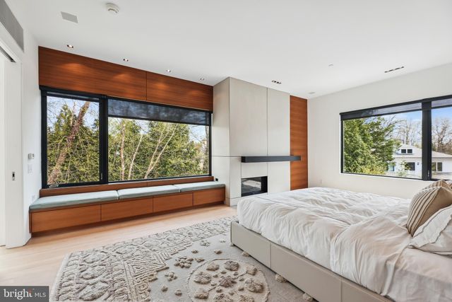 a spacious bathroom with a double vanity sink a large mirror and a shower