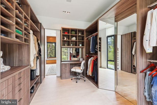 a bedroom with a large bed and a large window