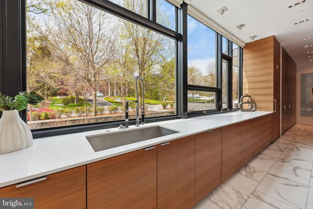 a view of a hallway with stairs