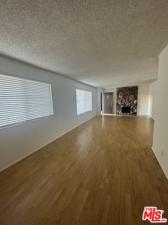 11525 Rochester Avenue, Unit 201 Los Angeles, CA 90025 - Photo 2 of 12 a view of an empty room and window