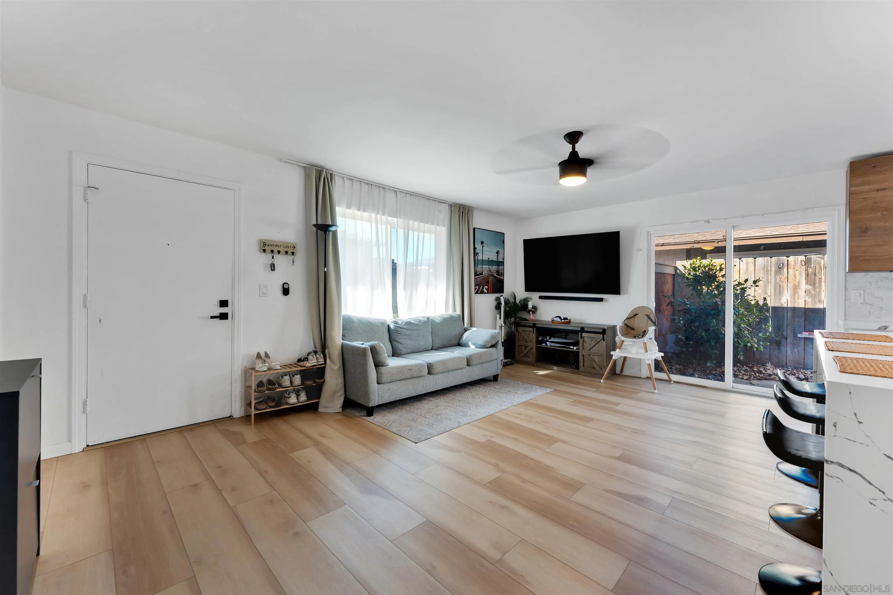 1622 Summertime Drive El Cajon, CA 92021 - Photo 12 of 27 a view of a livingroom with furniture and a flat screen tv