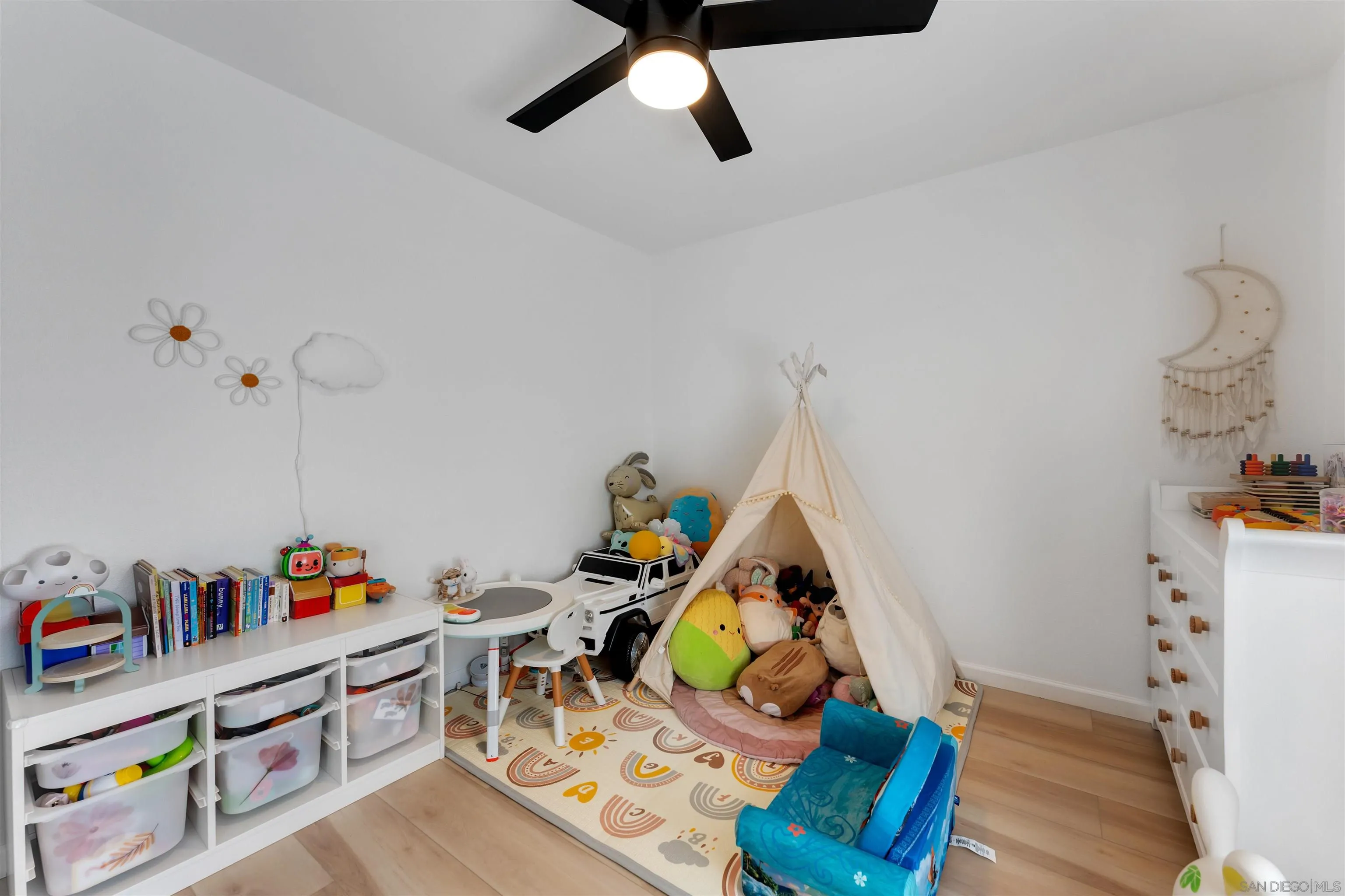 1622 Summertime Drive El Cajon, CA 92021 - Photo 19 of 27 a bed room with furniture and book shelf
