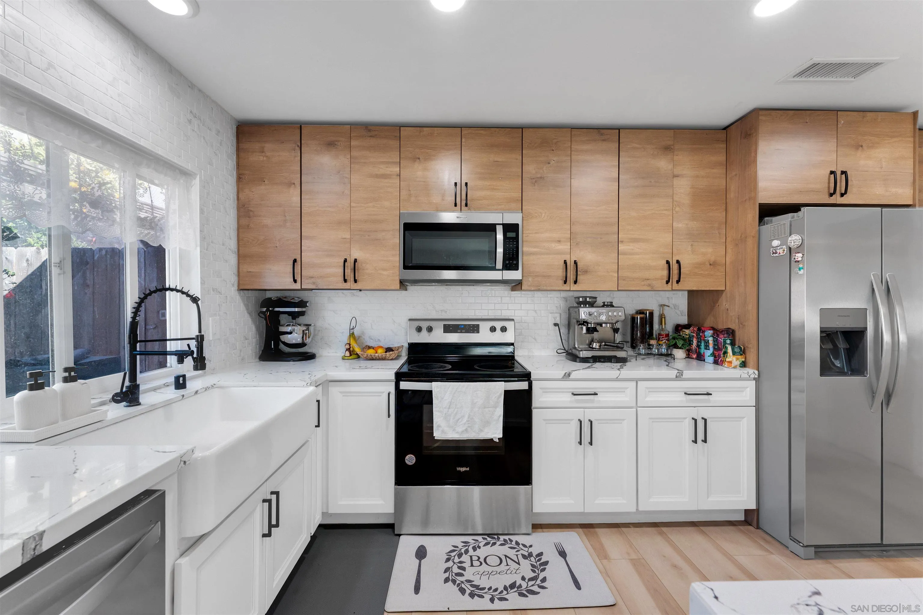 1622 Summertime Drive El Cajon, CA 92021 - Photo 22 of 27 a kitchen with a sink stove and refrigerator
